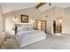Bright main bedroom with vaulted ceilings, walk-in closet, and ensuite bathroom at 5034 E Otero Cir, Centennial, CO 80122