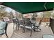 Outdoor patio with dining set, awning, and wrought iron furniture at 5034 E Otero Cir, Centennial, CO 80122