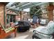 Back patio featuring an outdoor kitchen and lounge area with comfortable seating at 5034 E Otero Cir, Centennial, CO 80122