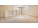 Finished basement featuring carpet, shelving, storage, and natural light from multiple windows at 4490 Balsam St, Wheat Ridge, CO 80033