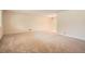 Large, bright living room with neutral carpet, offering a versatile space for relaxation and entertainment at 4490 Balsam St, Wheat Ridge, CO 80033