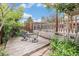 Backyard deck with outdoor seating surrounded by lush greenery at 6235 W Floyd Ave, Denver, CO 80227