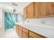 Functional bathroom with a large vanity with ample counter space and shower with a tub at 6235 W Floyd Ave, Denver, CO 80227
