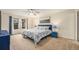 Cozy bedroom with a queen bed, soft lighting, and blue accents at 6235 W Floyd Ave, Denver, CO 80227