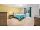 Bedroom featuring neutral walls and a yellow accent wall at 6235 W Floyd Ave, Denver, CO 80227