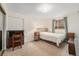 Cozy bedroom with neutral carpet, a closet, and plenty of natural light at 6235 W Floyd Ave, Denver, CO 80227