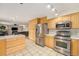 Well-equipped kitchen with stainless appliances, plenty of storage, and an open flow into the living space at 6235 W Floyd Ave, Denver, CO 80227
