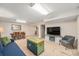 Inviting living room with dining area, a television and a sofa at 6235 W Floyd Ave, Denver, CO 80227
