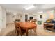 Spacious living room featuring neutral carpet, a large table and ample seating at 6235 W Floyd Ave, Denver, CO 80227