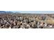 Panoramic aerial view of the neighborhood showcases homes and green spaces near the mountains at 6508 Moss Cir, Arvada, CO 80007