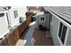 Exterior view of a backyard with gravel, shed, and mature trees at 6508 Moss Cir, Arvada, CO 80007