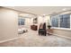 Bedroom area featuring carpet flooring, neutral paint, and a sitting area at 6508 Moss Cir, Arvada, CO 80007