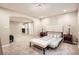 Bedroom area featuring carpet flooring, neutral paint, and a sitting bench at 6508 Moss Cir, Arvada, CO 80007