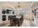 Elegant dining area featuring a large table, fireplace, and expansive windows offering lovely views at 6508 Moss Cir, Arvada, CO 80007