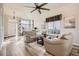 Cozy living room with comfortable seating, a large window, and contemporary decor creating a relaxing ambiance at 6508 Moss Cir, Arvada, CO 80007