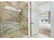 Modern bathroom boasts large glass shower with marble tile, providing a spa-like experience at 7202 Canyonpoint Rd, Castle Pines, CO 80108