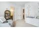 Bright Bedroom with whimsical decor, a cozy chair, and convenient access to the ensuite bathroom at 7202 Canyonpoint Rd, Castle Pines, CO 80108