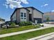 Charming two-story home boasts stone accents, a well-manicured lawn, and professional landscaping at 7202 Canyonpoint Rd, Castle Pines, CO 80108