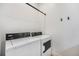 Functional laundry area equipped with a washer, dryer, and ample space for storage at 7202 Canyonpoint Rd, Castle Pines, CO 80108