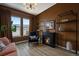 Inviting living room boasts a cozy fireplace, ample natural light, and stylish decor at 7202 Canyonpoint Rd, Castle Pines, CO 80108