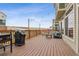 Relaxing back deck featuring a grill, hammock, and overhead string lights for outdoor entertaining at 18108 E 52Nd Ave, Denver, CO 80249