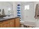 Bright bathroom with a shower, vanity, and decorative accents at 18108 E 52Nd Ave, Denver, CO 80249