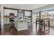 Modern kitchen with stainless steel appliances, sleek countertops and a center island with seating at 18108 E 52Nd Ave, Denver, CO 80249