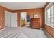 Comfortable bedroom with neutral walls, closet door and a door to the bathroom at 18108 E 52Nd Ave, Denver, CO 80249