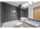 Bathroom with dark vanity and shower/tub combo at 7820 W 87Th Dr # K, Arvada, CO 80005
