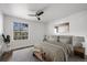 Bright bedroom with ceiling fan and large window at 7820 W 87Th Dr # K, Arvada, CO 80005