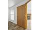 Hallway with wood door leading to the living room at 7820 W 87Th Dr # K, Arvada, CO 80005