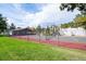 Community tennis court with green grass at 7820 W 87Th Dr # K, Arvada, CO 80005