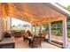 Outdoor patio area with string lights, a grill, and comfortable seating at 3902 Eagle Tail Ln, Castle Rock, CO 80104