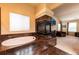 Relaxing bathroom with a tiled fireplace and a luxurious soaking tub at 3902 Eagle Tail Ln, Castle Rock, CO 80104