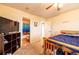 Cozy bedroom featuring carpet, a ceiling fan, and an attached bathroom at 3902 Eagle Tail Ln, Castle Rock, CO 80104