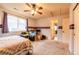 Bright bedroom featuring a ceiling fan, a large window, and ample storage at 3902 Eagle Tail Ln, Castle Rock, CO 80104