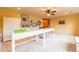 Bright bonus room with neutral carpet, ceiling fan and white storage at 3902 Eagle Tail Ln, Castle Rock, CO 80104