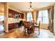 Charming breakfast nook with lots of light, a wooden table, and cabinetry and countertops along one wall at 3902 Eagle Tail Ln, Castle Rock, CO 80104
