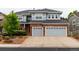 Charming two-story home with a brick facade and a two-car garage showcasing curb appeal at 3902 Eagle Tail Ln, Castle Rock, CO 80104