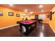 Finished basement game room features a pool table, hardwood floors, and modern recessed lighting at 3902 Eagle Tail Ln, Castle Rock, CO 80104