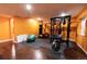 Finished basement gym area features free weights, squat rack, bench press, rubber mat flooring at 3902 Eagle Tail Ln, Castle Rock, CO 80104