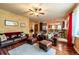 Spacious living room flows into the kitchen, features hardwood floors and open space at 3902 Eagle Tail Ln, Castle Rock, CO 80104