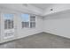 Bedroom with a large window and door, providing ample natural light and outdoor access at 10715 Twenty Mile Rd # 203, Parker, CO 80134