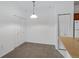 Eat-in dining area with storage closet and hanging pendant light at 10715 Twenty Mile Rd # 203, Parker, CO 80134