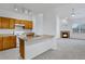 Open layout with views of kitchen and a cozy living room fireplace at 10715 Twenty Mile Rd # 203, Parker, CO 80134