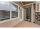 Cozy porch with wooden flooring and exterior doors, perfect for relaxing outdoors at 10715 Twenty Mile Rd # 203, Parker, CO 80134