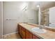 Bathroom with double vanity, granite counters, and walk-in shower at 9300 E Florida Ave # 1107, Denver, CO 80247