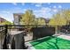 Outdoor patio with artificial turf and view of surrounding neighborhood at 9300 E Florida Ave # 1107, Denver, CO 80247