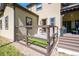 View of the home's backyard with a fenced-in dog run and access to a covered deck space at 230 S Big Meadow Trl, Franktown, CO 80116