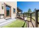 Home's backyard featuring a fenced in dog run area with an easy access door to the covered deck space at 230 S Big Meadow Trl, Franktown, CO 80116